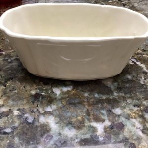 This small off-white ceramic dish is homemade by someone in the USA years ago.